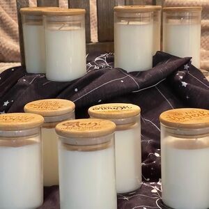 Eight ounces hand poured soy candles in glass containers w/bamboo lids.